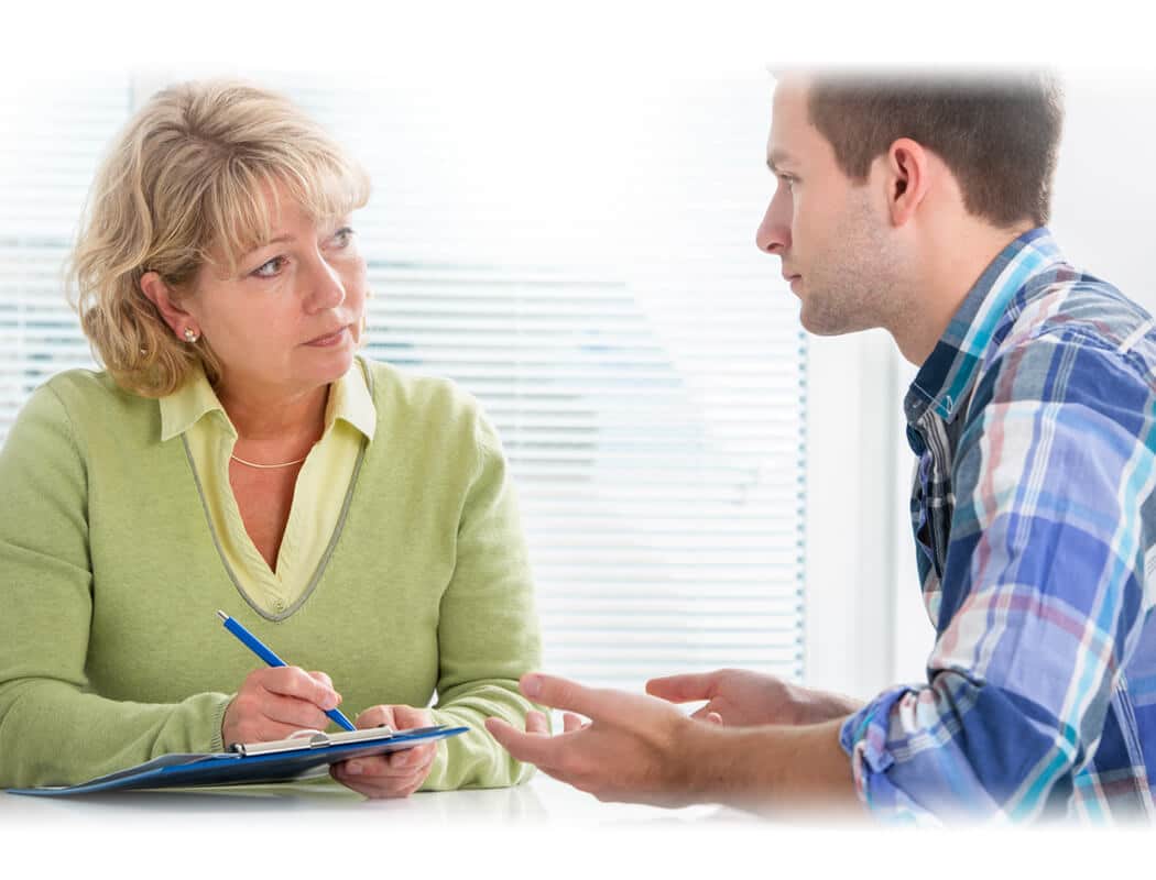 A patient discussing his illness with a doctor.